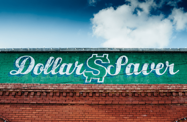 Mural painted on a brick building with the words 'Dollar Saver'