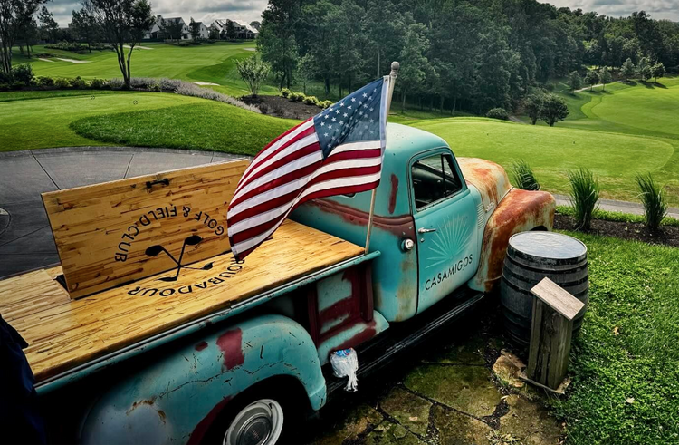 Image of an old pickup truck parked next to the Troubadour golf course