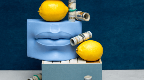 Abstract image of a blue face with money and lemons.