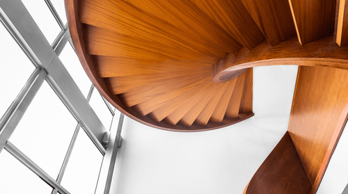 Image looking up at a spiral stairwell.